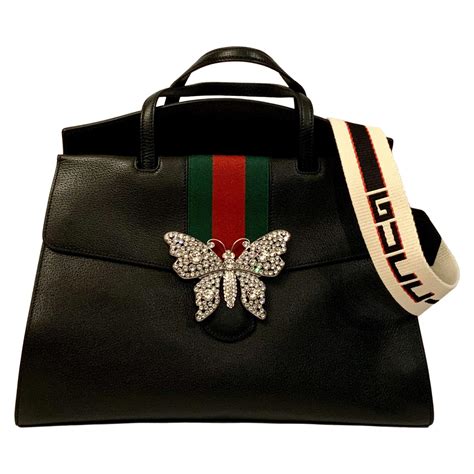 gucci lions head bags|Gucci butterfly animal logo.